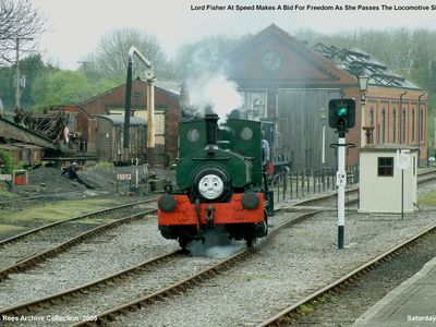 Just another day at Cranmore when Lord Fisher makes a bid for freedom as she passes the locomotive shed at speed. Picture taken Saturday 30th April 2005.